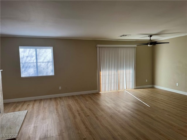8600 W Charleston Blvd Unit 2161, Las Vegas, NV 89117 - spare room featuring wood finished floors, crown molding, and a ceiling fan