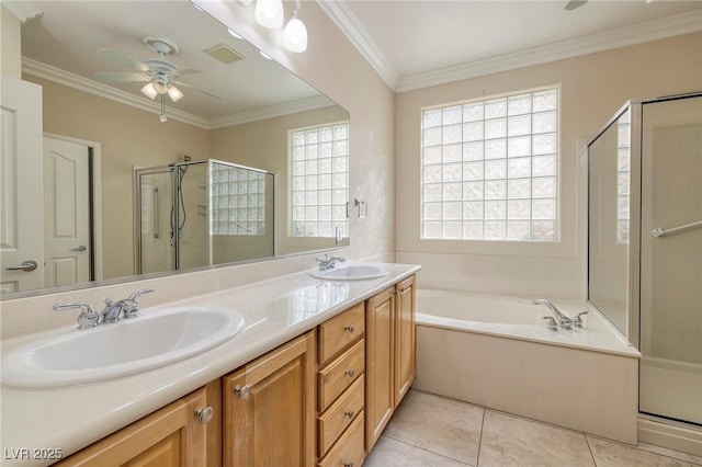 2559 Deora Way, Henderson, NV 89052 - bathroom featuring a shower stall, a ceiling fan, a bath, double vanity, and crown molding