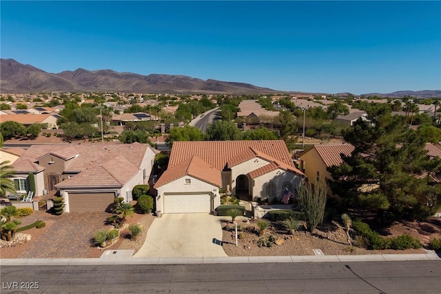 2559 Deora Way, Henderson, NV 89052 - view of front of house with driveway, a residential view, a mountain view, and an attached garage