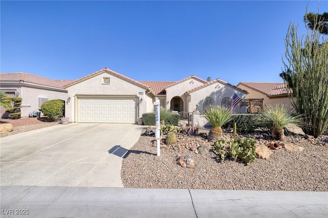2559 Deora Way, Henderson, NV 89052 - mediterranean / spanish house featuring a garage, concrete driveway, stucco siding, and a tile roof