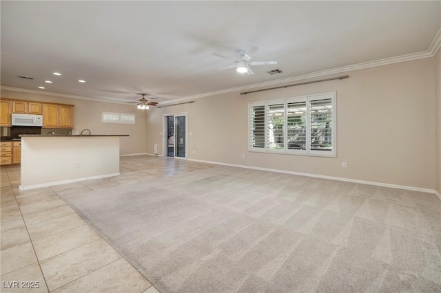 2559 Deora Way, Henderson, NV 89052 - unfurnished living room featuring crown molding, ceiling fan, light tile patterned floors, and recessed lighting