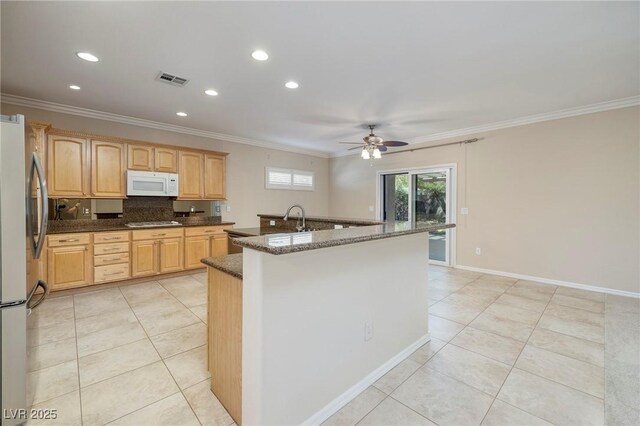 2559 Deora Way, Henderson, NV 89052 - kitchen featuring stainless steel appliances, light tile patterned floors, ceiling fan, crown molding, and recessed lighting