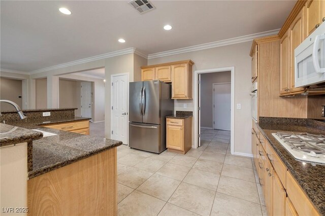 2559 Deora Way, Henderson, NV 89052 - kitchen featuring white appliances, ornamental molding, light tile patterned floors, light brown cabinetry, and dark stone counters