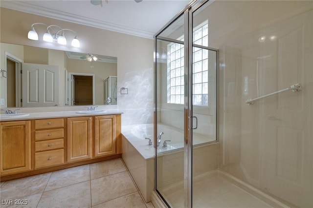 2559 Deora Way, Henderson, NV 89052 - full bath with ornamental molding, double vanity, a shower stall, a garden tub, and tile patterned floors