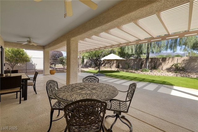 2559 Deora Way, Henderson, NV 89052 - fenced backyard with outdoor dining space, a ceiling fan, a pergola, and a patio area