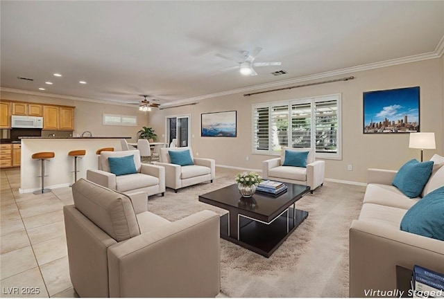 2559 Deora Way, Henderson, NV 89052 - living room featuring a ceiling fan, crown molding, healthy amount of natural light, light tile patterned floors, and recessed lighting