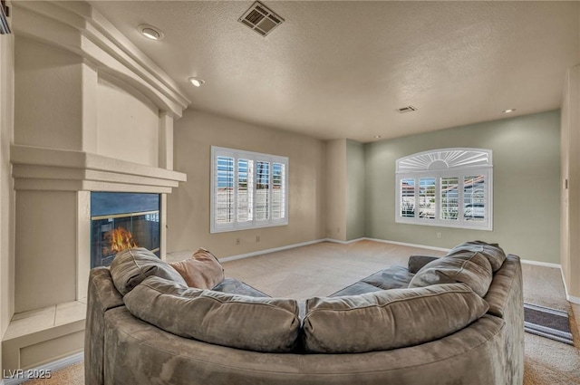 1971 Del Font Ct, Las Vegas, NV 89117 - carpeted living area featuring healthy amount of natural light, a textured ceiling, a fireplace, and recessed lighting