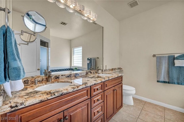 1971 Del Font Ct, Las Vegas, NV 89117 - full bath with double vanity, a garden tub, and tile patterned floors