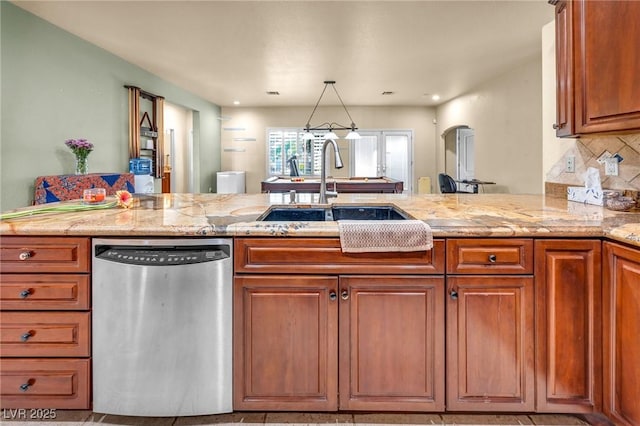 1971 Del Font Ct, Las Vegas, NV 89117 - kitchen featuring stainless steel dishwasher, a peninsula, brown cabinetry, backsplash, and light stone counters