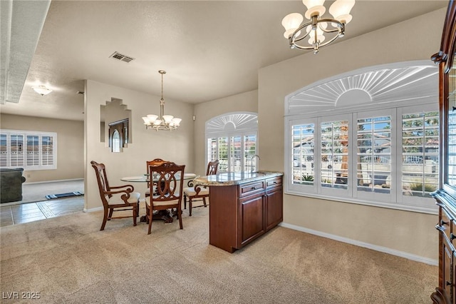 1971 Del Font Ct, Las Vegas, NV 89117 - dining space featuring a chandelier and light colored carpet