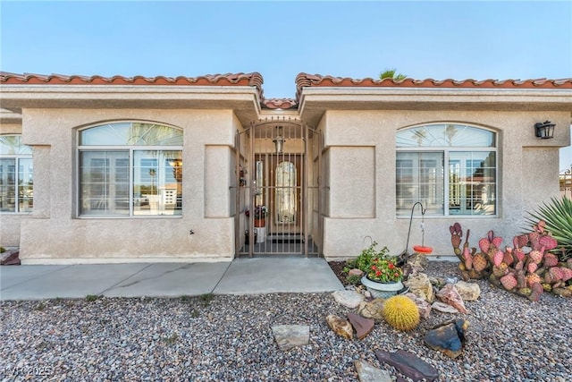 1971 Del Font Ct, Las Vegas, NV 89117 - entrance to property with stucco siding and a tile roof