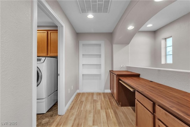 5001 Pounding Surf Ave, Las Vegas, NV 89131 - laundry area with washer / clothes dryer, light wood-style flooring, cabinet space, recessed lighting, and built in shelves
