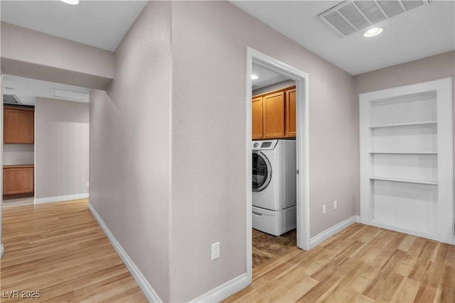 5001 Pounding Surf Ave, Las Vegas, NV 89131 - laundry area with washer / clothes dryer, cabinet space, light wood-style flooring, recessed lighting, and built in features