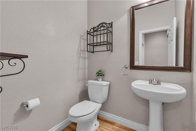 5001 Pounding Surf Ave, Las Vegas, NV 89131 - half bath with toilet and wood finished floors