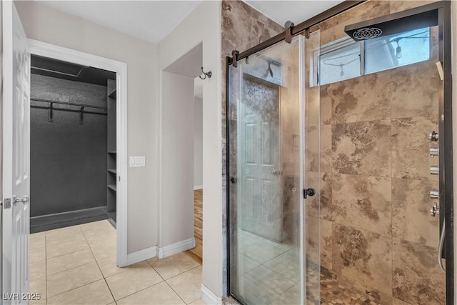 5001 Pounding Surf Ave, Las Vegas, NV 89131 - bathroom with a shower stall, a spacious closet, and tile patterned flooring