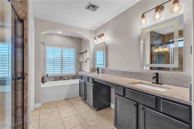 5001 Pounding Surf Ave, Las Vegas, NV 89131 - full bathroom with tile patterned floors, a stall shower, a garden tub, and double vanity