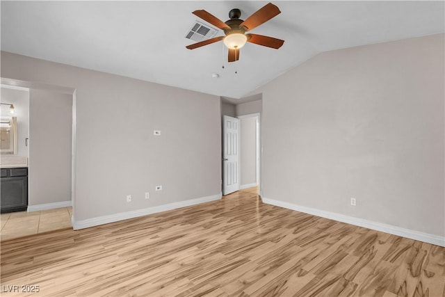5001 Pounding Surf Ave, Las Vegas, NV 89131 - unfurnished bedroom featuring light wood-type flooring, vaulted ceiling, ensuite bathroom, and a ceiling fan
