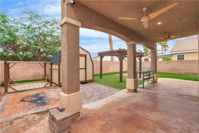 5001 Pounding Surf Ave, Las Vegas, NV 89131 - fenced backyard featuring a shed, a patio area, ceiling fan, and a pergola