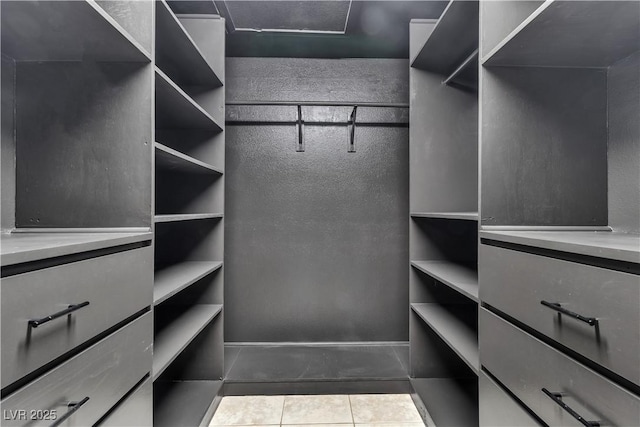 5001 Pounding Surf Ave, Las Vegas, NV 89131 - walk in closet featuring tile patterned flooring