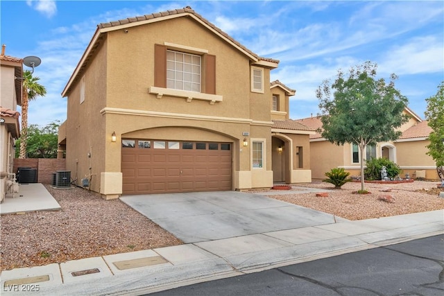 5001 Pounding Surf Ave, Las Vegas, NV 89131 - view of front facade featuring a garage, stucco siding, a tile roof, and concrete driveway