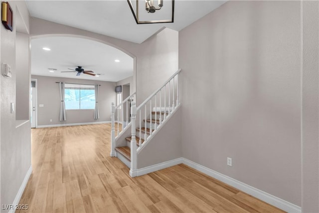 5001 Pounding Surf Ave, Las Vegas, NV 89131 - foyer with arched walkways, stairs, light wood-type flooring, recessed lighting, and ceiling fan
