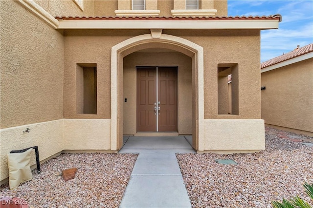 5001 Pounding Surf Ave, Las Vegas, NV 89131 - property entrance featuring stucco siding and a tile roof