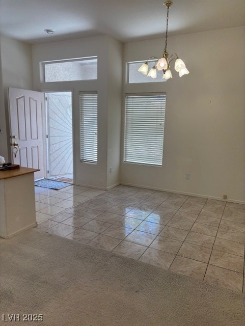 3013 Abercorn Dr, Las Vegas, NV 89134 - unfurnished room featuring a chandelier and light tile patterned flooring