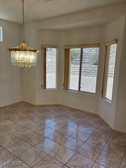 3013 Abercorn Dr, Las Vegas, NV 89134 - empty room featuring a chandelier and light tile patterned floors