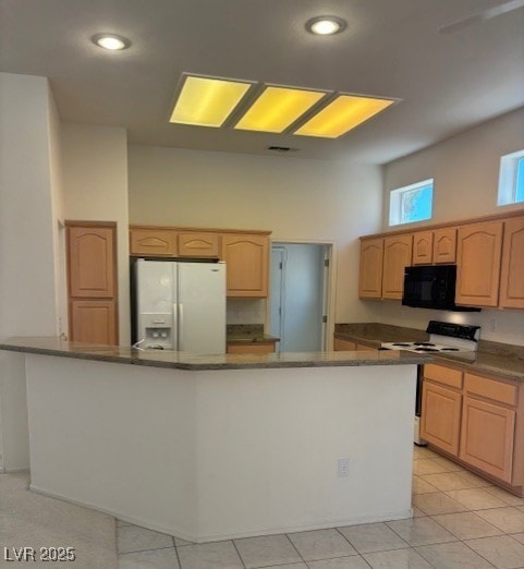 3013 Abercorn Dr, Las Vegas, NV 89134 - kitchen with white appliances, dark countertops, light brown cabinets, recessed lighting, and a towering ceiling