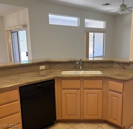 3013 Abercorn Dr, Las Vegas, NV 89134 - kitchen featuring black dishwasher, light stone countertops, light tile patterned floors, and ceiling fan