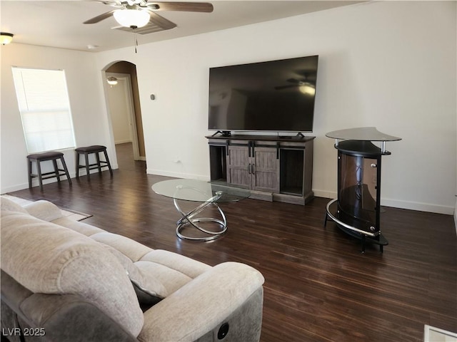 161 Diamond Bar Rd, Pahrump, NV 89048 - living room featuring ceiling fan, arched walkways, and wood finished floors