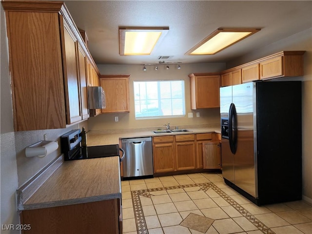 161 Diamond Bar Rd, Pahrump, NV 89048 - kitchen with appliances with stainless steel finishes, light tile patterned flooring, and light countertops