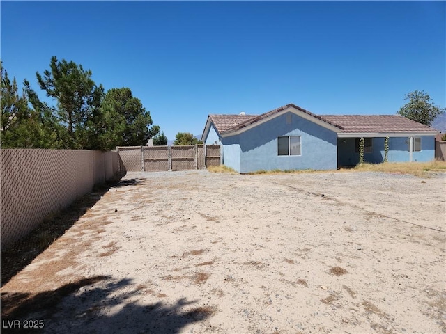 161 Diamond Bar Rd, Pahrump, NV 89048 - view of home's exterior with stucco siding and a tiled roof
