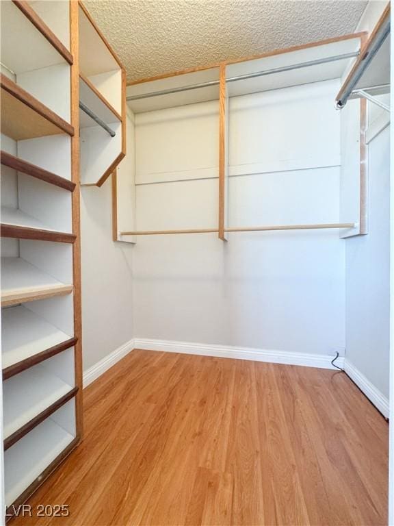 6437 Peachwood Rd, Las Vegas, NV 89108 - spacious closet featuring wood finished floors