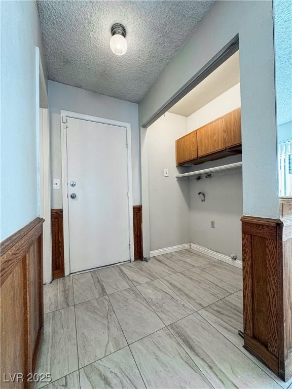 6437 Peachwood Rd, Las Vegas, NV 89108 - laundry room with washer hookup and a textured ceiling