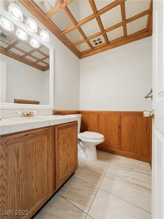 6437 Peachwood Rd, Las Vegas, NV 89108 - bathroom featuring vanity, wainscoting, and tile patterned flooring