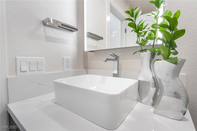 9332 Sienna Vista Dr, Las Vegas, NV 89117 - bathroom view of a textured wall and vanity
