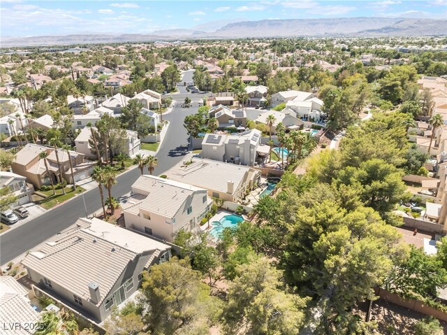 9332 Sienna Vista Dr, Las Vegas, NV 89117 - aerial view of residential area featuring a mountainous background and a pool area