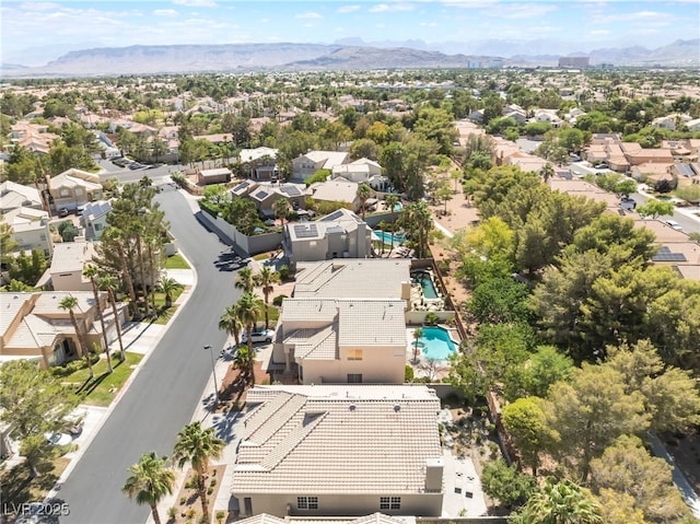 9332 Sienna Vista Dr, Las Vegas, NV 89117 - aerial view of residential area featuring a mountainous background and a pool