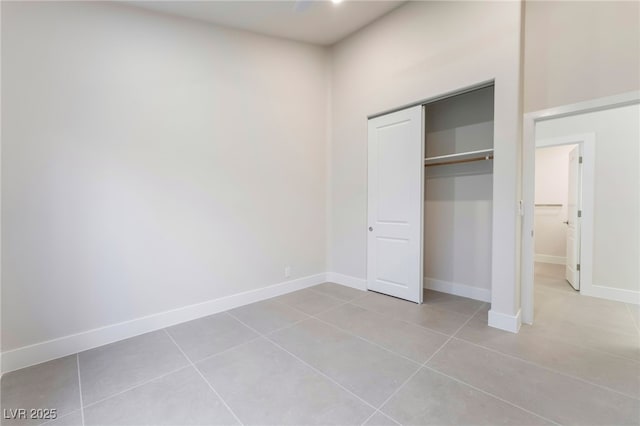 9332 Sienna Vista Dr, Las Vegas, NV 89117 - unfurnished bedroom featuring light tile patterned floors and a closet