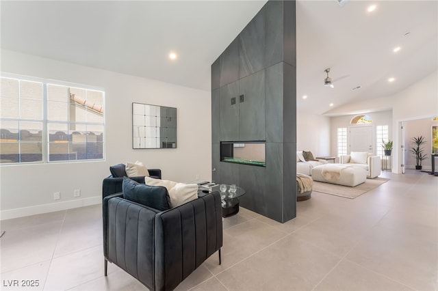 9332 Sienna Vista Dr, Las Vegas, NV 89117 - living room with recessed lighting, light tile patterned floors, high vaulted ceiling, a fireplace, and ceiling fan