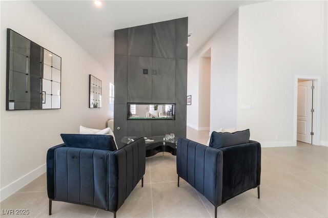 9332 Sienna Vista Dr, Las Vegas, NV 89117 - living area with baseboards and light tile patterned floors