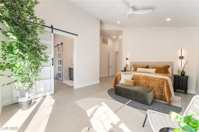 9332 Sienna Vista Dr, Las Vegas, NV 89117 - bedroom featuring a barn door, light tile patterned floors, recessed lighting, and lofted ceiling