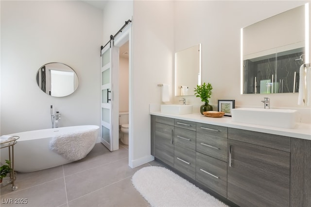 9332 Sienna Vista Dr, Las Vegas, NV 89117 - bathroom with double vanity, tile patterned flooring, and a freestanding bath