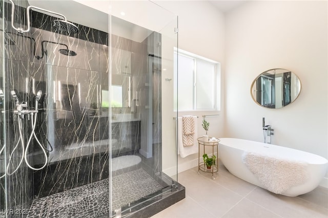 9332 Sienna Vista Dr, Las Vegas, NV 89117 - full bathroom with a shower stall, a freestanding tub, and tile patterned flooring