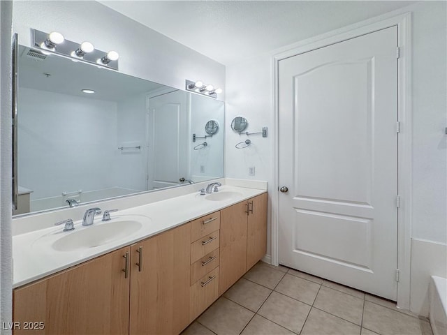 38 E Serene Ave Unit 402, Las Vegas, NV 89123 - bathroom featuring double vanity, tile patterned flooring, and a bath