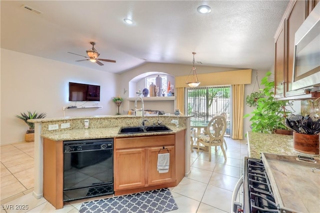 3032 Prairie Princess Ave, North Las Vegas, NV 89081 - kitchen featuring dishwasher, lofted ceiling, gas range oven, stainless steel microwave, and a ceiling fan