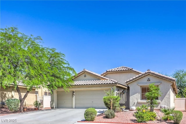 3032 Prairie Princess Ave, North Las Vegas, NV 89081 - view of front of house featuring a garage, concrete driveway, stucco siding, and a gate