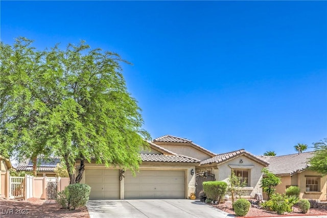3032 Prairie Princess Ave, North Las Vegas, NV 89081 - view of front facade featuring concrete driveway, a garage, stucco siding, and a tile roof
