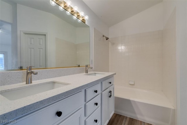 5201 S Torrey Pines Dr Unit 1184, Las Vegas, NV 89118 - bathroom with double vanity, wood finished floors, and shower / bathtub combination